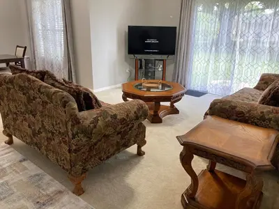 a living room with a couch and a coffee table at Orlando HomeDisney and beach in Orlando