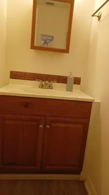 a bathroom with a sink and a mirror at Orlando HomeDisney and beach in Orlando