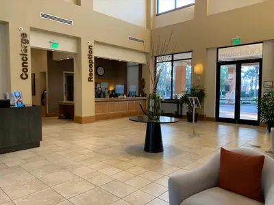 a lobby with a waiting area in a hospital at Spacious 4 BR Townhouse with 2 King Size Master Bedrooms, 3 miles to Disney, Free WiFi and Free Parking in Orlando