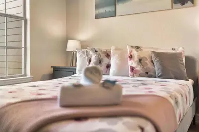 a bedroom with a bed with a purse on it at Secret Resort Kissimmee Lakeview Condo in Kissimmee