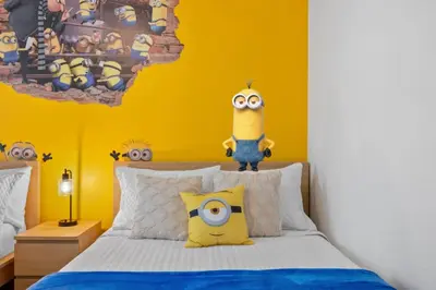 a bedroom with a minion on top of a bed at Magical Disney Getaway- Belle Potter & Minions in Kissimmee