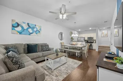 a living room with a couch and a table at Magical Disney Getaway- Belle Potter & Minions in Kissimmee