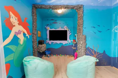 a room with a mermaid mural on the wall at Windsor Hills Family-Friendly 3BR Pool Townhome in Orlando