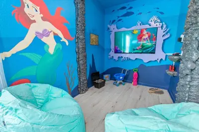 a room with a mermaid mural on the wall at Windsor Hills Family-Friendly 3BR Pool Townhome in Orlando