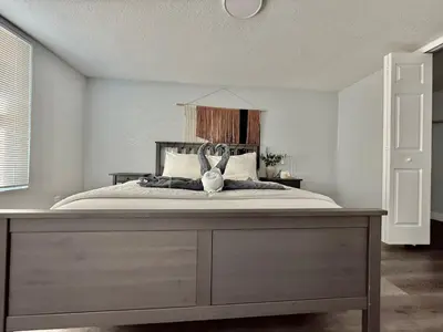 a bedroom with a bed with a rabbit on it at Relaxing 3BR Home Near Orlando Downtown & Parks in Orlando