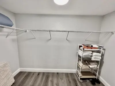 a laundry room with a towel rack with towels at Relaxing 3BR Home Near Orlando Downtown & Parks in Orlando