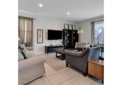 a living room with two couches and a tv at 321 PC - Encore Oasis Luxury 5BR Home Private Pool in Orlando