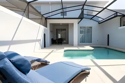 a swimming pool in a house with a glass ceiling at Casa 4Q c/ Piscina e Quartos Temáticos in Kissimmee