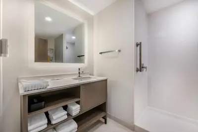 a bathroom with a sink and a shower at Comfort Inn & Suites Orlando Sanford Airport in Sanford