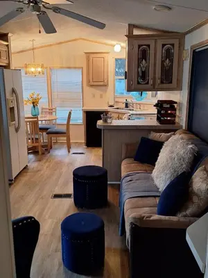 a living room with a couch and a kitchen at A house near Disney and Universal - mikeyfl-1 in Kissimmee