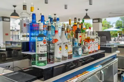 a counter with many bottles of alcohol on it at Vista Cay Penthouse Luxury in Orlando
