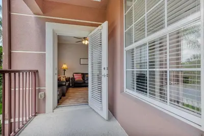 a hallway leading to a room with a window at Conservation View Updated WOW in Orlando