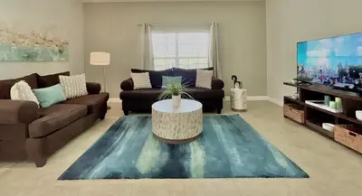 a living room with a couch and a table at Cheerful 5 Bdr Sunny Pool in Kissimmee
