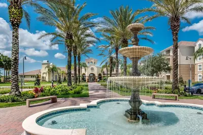a fountain in a park with palm trees at WOW Huge Stunner Corner in Orlando