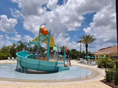 a water slide in a pool at a resort at WOW Upscale Penthouse in Orlando