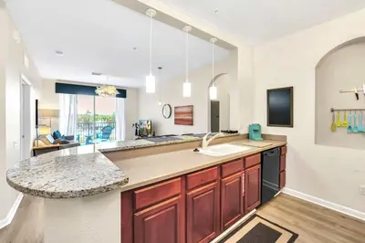 a large kitchen with a sink and a counter at Lake & Pool View Fireworks in Orlando