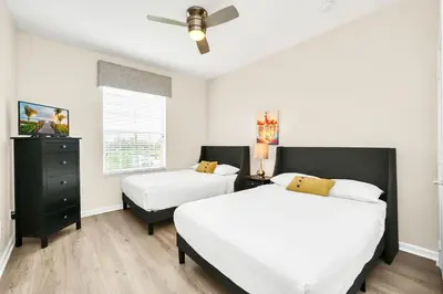 a bedroom with two beds and a window at Lake & Pool View Fireworks in Orlando