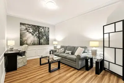 a living room with a couch and two tables at Huge Stunning Corner Home 304 in Orlando