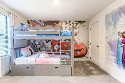 a bedroom with two bunk beds in a room at Luxury Town House Near Disney in Kissimmee
