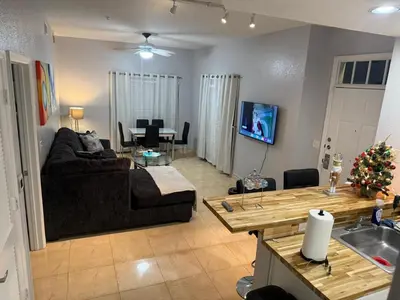a living room with a couch and a table at Luxury house in Disney in Kissimmee