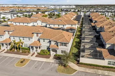 an aerial view of a row of houses at 5 Bedrooms 4 Bathrooms Storey Lake 4984Wa in Kissimmee