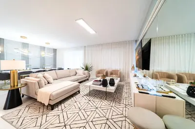 a living room with a couch and a table at Themed 9BR Retreat Pool & Soccer Fun in Kissimmee