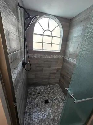 a bathroom with a shower with a window at 3beds 2baths Condo in Kissimmee, FL in Kissimmee