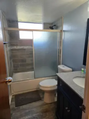 a bathroom with a shower and a toilet and a sink at 3beds 2baths Condo in Kissimmee, FL in Kissimmee