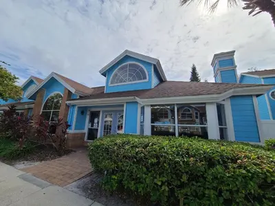 a blue house with a blue roof at 3beds 2baths Condo in Kissimmee, FL in Kissimmee