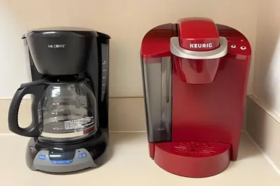 a red and black coffee maker sitting on a counter at Condo 3Q Windsor Hills — Perto da Disney in Orlando