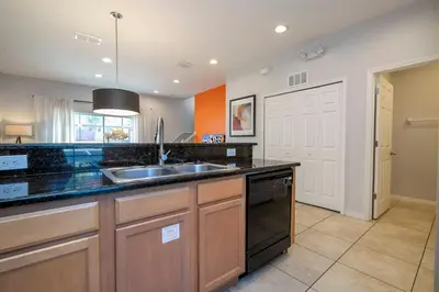 a kitchen with a sink and a stove at Beautiful 2 bedrooms with Hot tube in Kissimmee