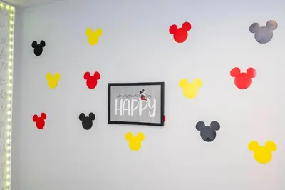 a wall with a picture of happy and many magnets at Beautiful 2 bedrooms with Hot tube in Kissimmee