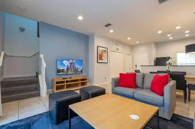 a living room with a couch and a table at Cozy 2 bedrooms with Hot tube in Kissimmee