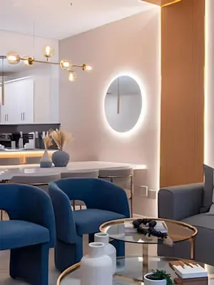 a living room with blue chairs and a table at Apto 2Q Storey Lake — Vista Lago e Clube in Kissimmee