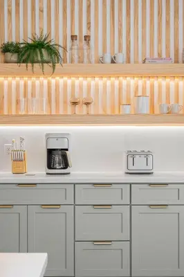 a kitchen with white cabinets and a coffee maker at 10min to Disney, Luxury 6BR Themed Villa with Private Pool,Spa and Game Room in Orlando