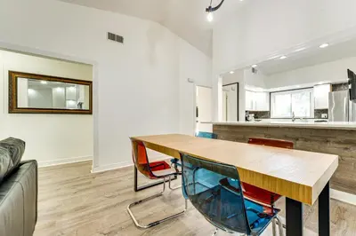 a dining room with a wooden table and chairs at 3 Mi to SeaWorld! Suburban Home with Screened Porch in Orlando