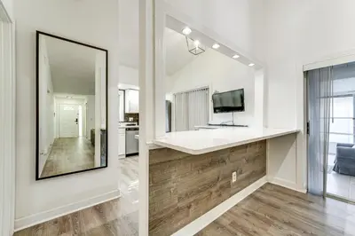 a bathroom with a sink and a mirror at 3 Mi to SeaWorld! Suburban Home with Screened Porch in Orlando