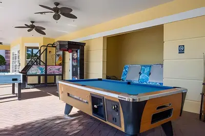 a pool table in the middle of a room at Casa 3Q Vista Cay – Perto da Universal & Centro in Orlando