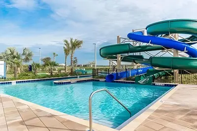 a water slide in a pool at a resort at Villa Sanches 4Q c/ Piscina – Storey Lake Resort in Kissimmee