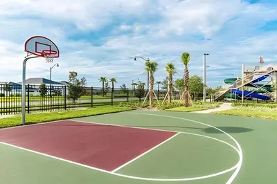 a basketball court with a hoop in a park at Villa Sanches 4Q c/ Piscina – Storey Lake Resort in Kissimmee