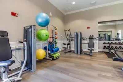 a fitness room with a gym with exercise equipment at Condo 3Q Vista Cay c/ Varanda e Piscina Resort in Orlando