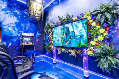 a room with a painting on a blue wall at Enchanting 6BR, Themed Rooms, Game Room and Resort in Kissimmee
