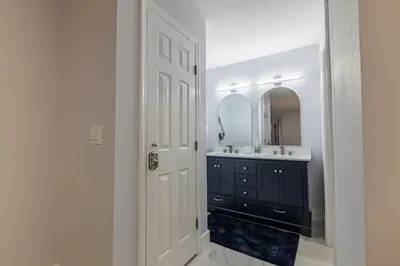 a bathroom with a black sink and a mirror at Family-Friendly Apartment Near Disney & Universal in Kissimmee