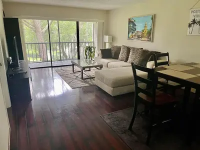 a living room with a couch and a table at Residence near trails, shopping in Orlando