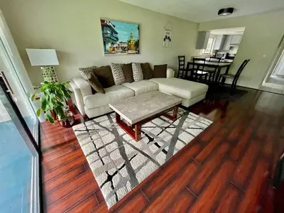 a living room with a couch and a table at Residence near trails, shopping in Orlando