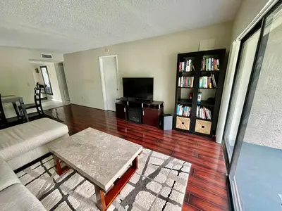a living room with a couch and a coffee table at Residence near trails, shopping in Orlando