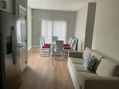 a living room with a couch and a table and chairs at Orlando Luxury Home in Orlando