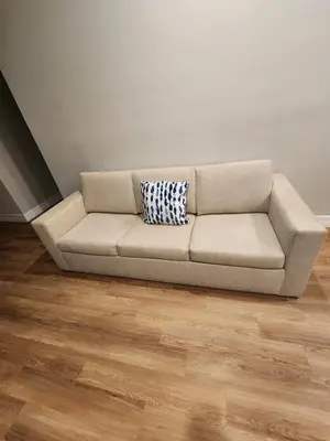 a couch sitting in a room with a wooden floor at Orlando Luxury Home in Orlando
