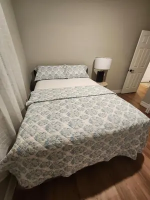 a bedroom with a bed with a blanket on it at Orlando Luxury Home in Orlando