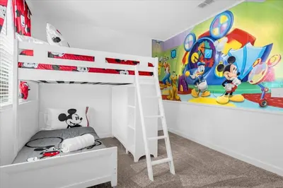 a bedroom with a bunk bed with a mickey mouse mural at Disney Escape Villa Pool Resort Amenities in Kissimmee
